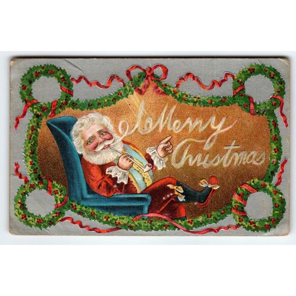 1909 Embossed Santa Claus Smokes Pipe Christmas Postcard Wreath Design - Picture 1 of 2